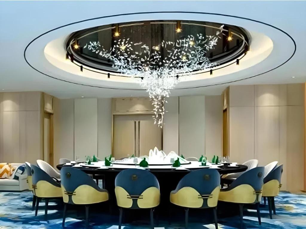 Fenggang Gladden Hotel Tiantangwei Bagian luar foto