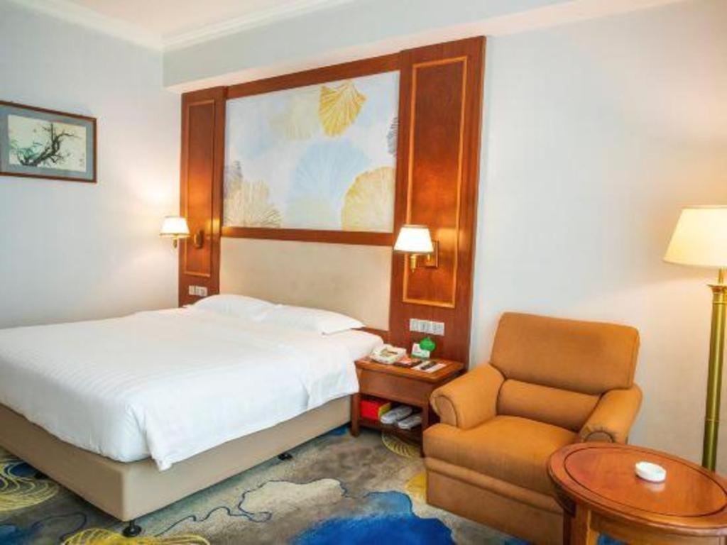 Fenggang Gladden Hotel Tiantangwei Bagian luar foto