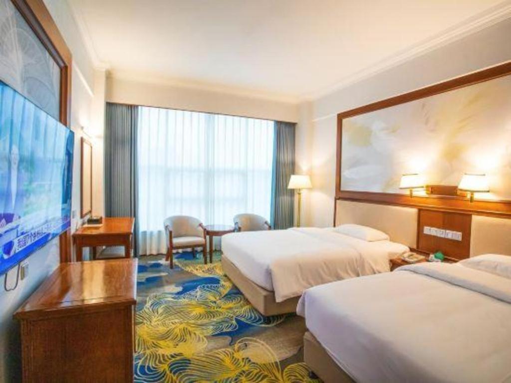 Fenggang Gladden Hotel Tiantangwei Bagian luar foto