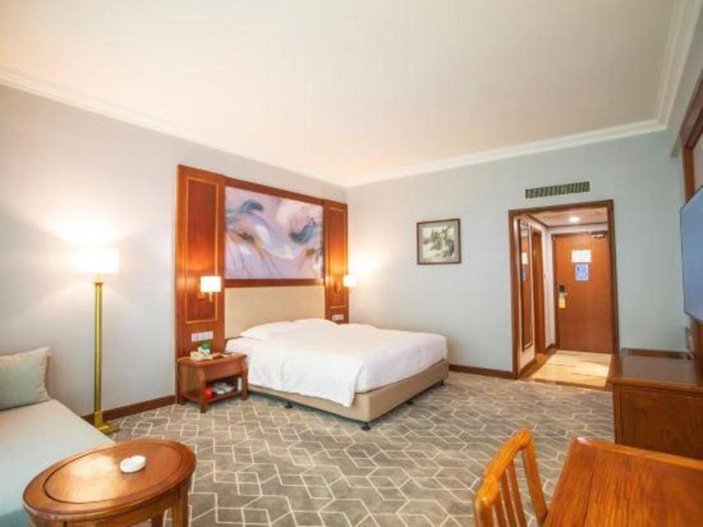 Fenggang Gladden Hotel Tiantangwei Bagian luar foto