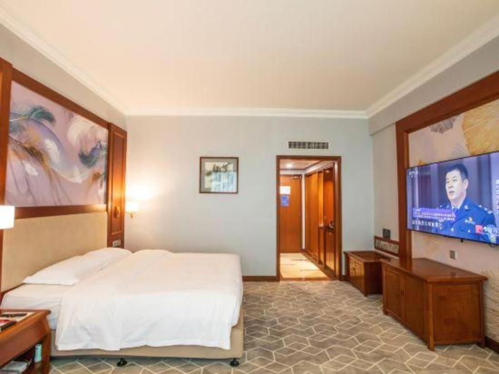 Fenggang Gladden Hotel Tiantangwei Bagian luar foto