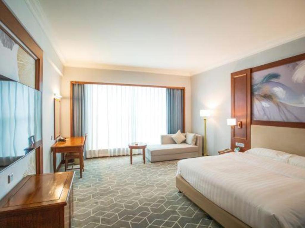 Fenggang Gladden Hotel Tiantangwei Bagian luar foto