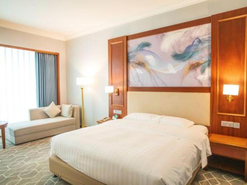 Fenggang Gladden Hotel Tiantangwei Bagian luar foto