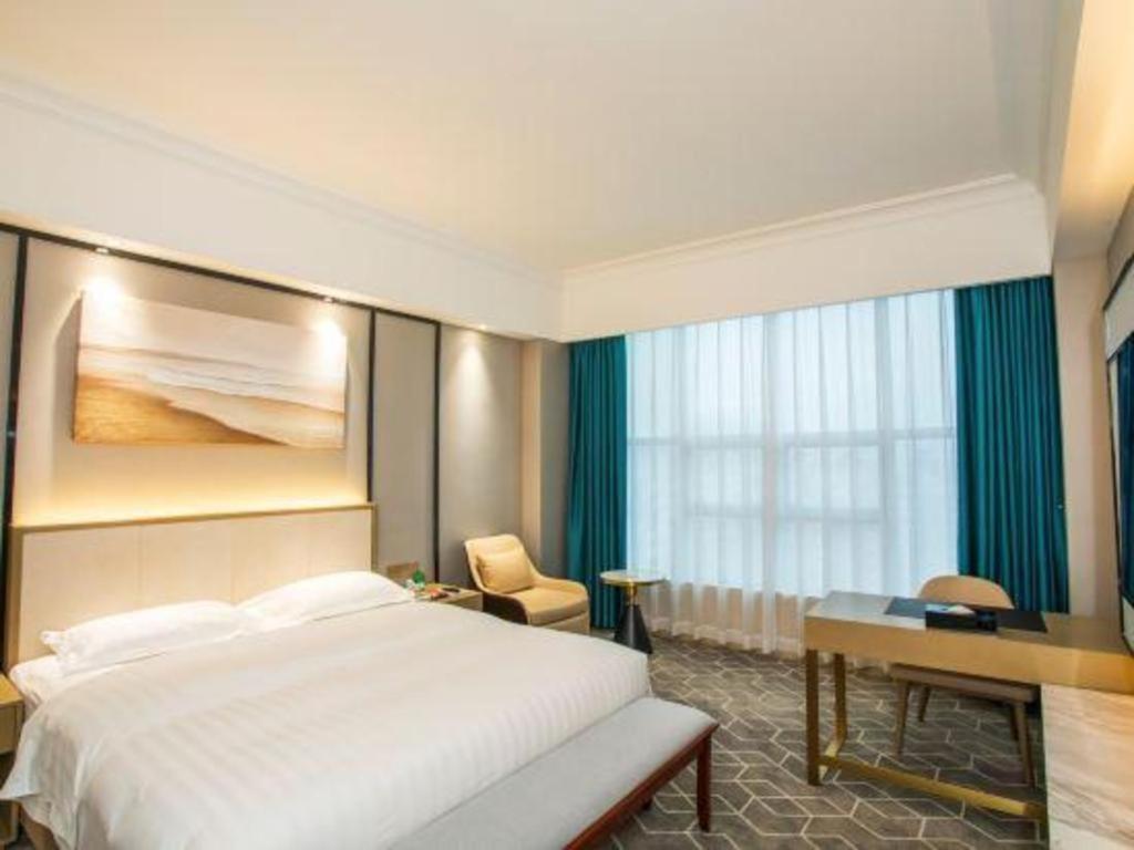 Fenggang Gladden Hotel Tiantangwei Bagian luar foto