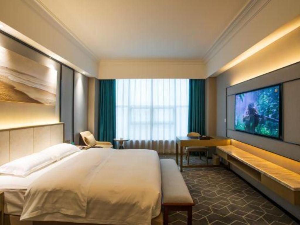 Fenggang Gladden Hotel Tiantangwei Bagian luar foto