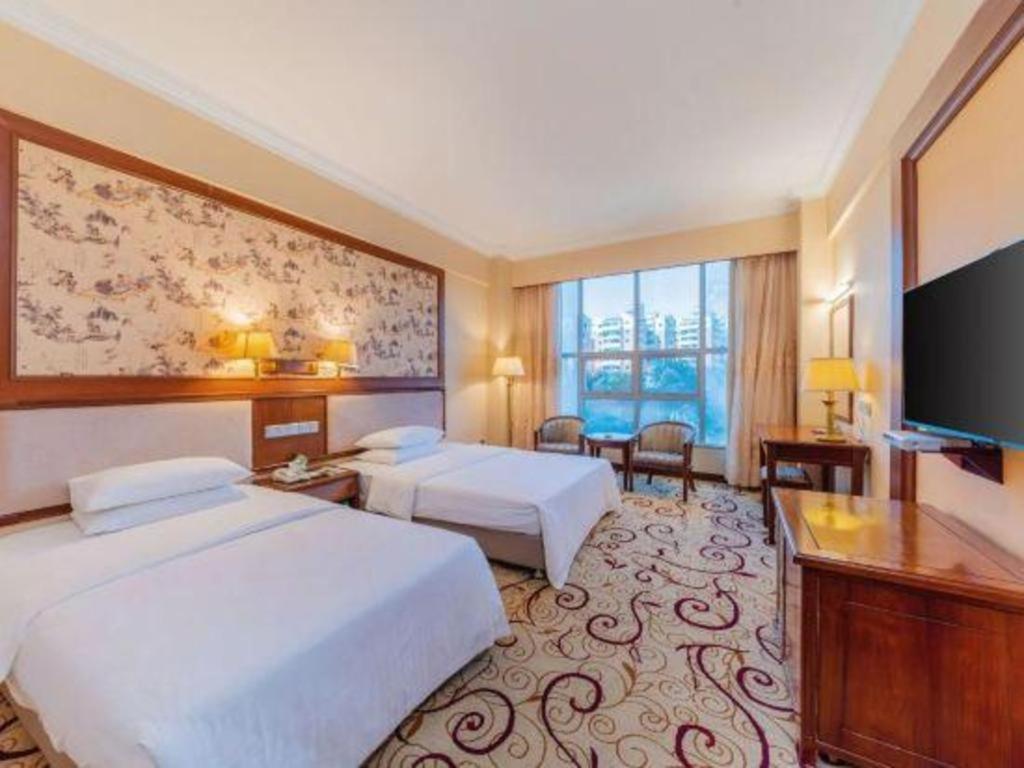 Fenggang Gladden Hotel Tiantangwei Bagian luar foto