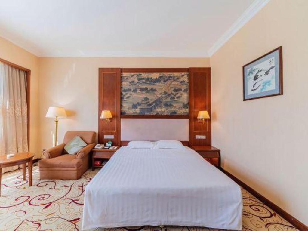 Fenggang Gladden Hotel Tiantangwei Bagian luar foto