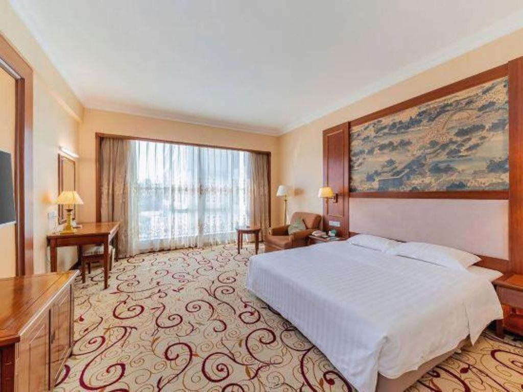 Fenggang Gladden Hotel Tiantangwei Bagian luar foto