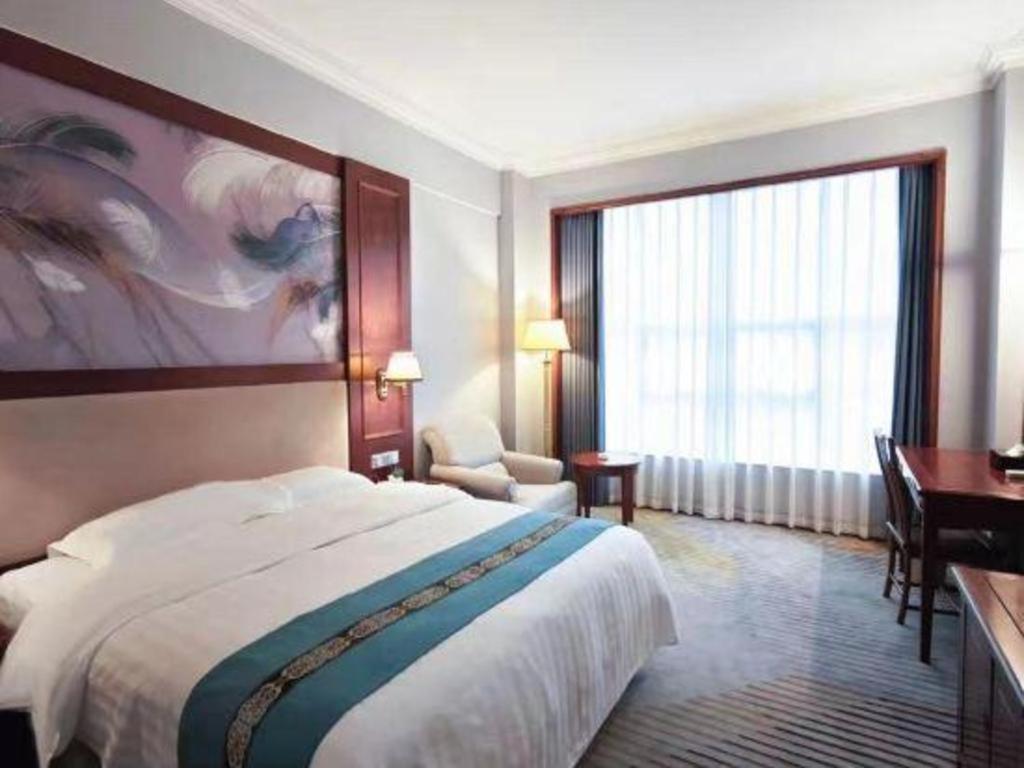 Fenggang Gladden Hotel Tiantangwei Bagian luar foto