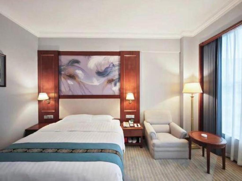 Fenggang Gladden Hotel Tiantangwei Bagian luar foto